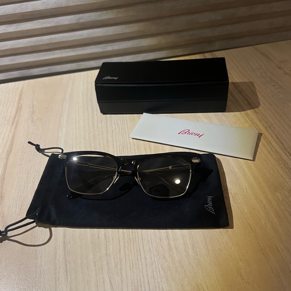 Brioni’s sunglasses.